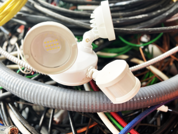 Electric LED bulbs resting on insulated wires